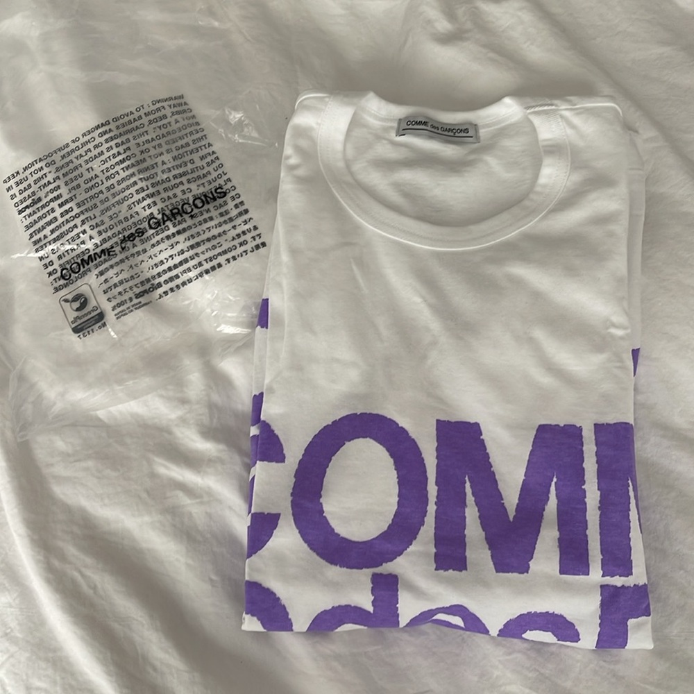 White Comme Des Garçons tee with purple lettering